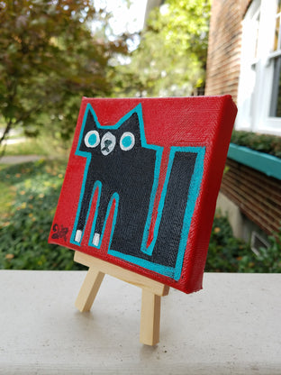 Black and White Cat on Red by Jessica JH Roller |  Side View of Artwork 