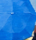 Original art for sale at UGallery.com | Aerial View of Couple under Blue Umbrella in Paris Rain by Warren Keating | $4,275 | oil painting | 48' h x 36' w | thumbnail 4