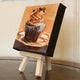 Original art for sale at UGallery.com | Mocha Cappuccino Cupcake by Jonelle Summerfield | $75 | oil painting | 4' h x 4' w | thumbnail 2